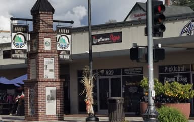 A street view featuring a sign and storefronts in Rancho Cordova.