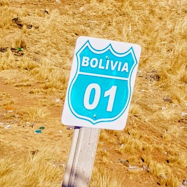 A road sign indicating Bolivia with a blue background and white text.