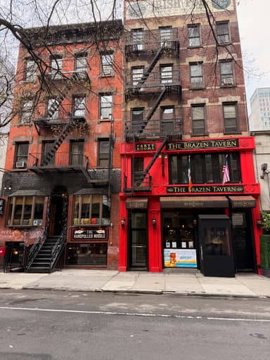 Two adjacent buildings with distinct facades in a city street.